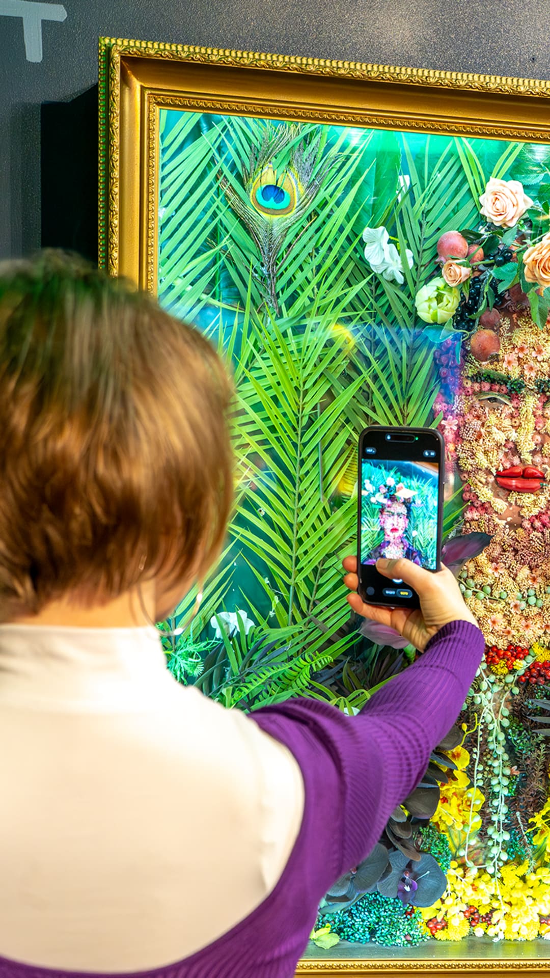 Close-up of a Frida Kahlo portrait built from dried flowers, berries and succulents at Food Art Museum Barcelona